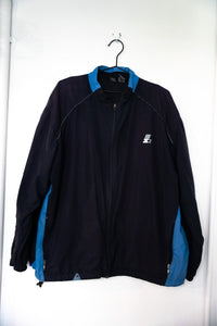 Black 90s Starter windbreaker jacket with blue side panels and collar white S star logo on left chest zippered pockets size XL