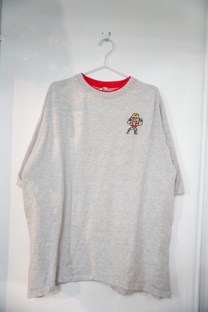 Heather gray 90s WWF Lex Luger t-shirt with red double collar and small embroidered cartoon Luger flexing in patriotic singlet on left chest size XXL