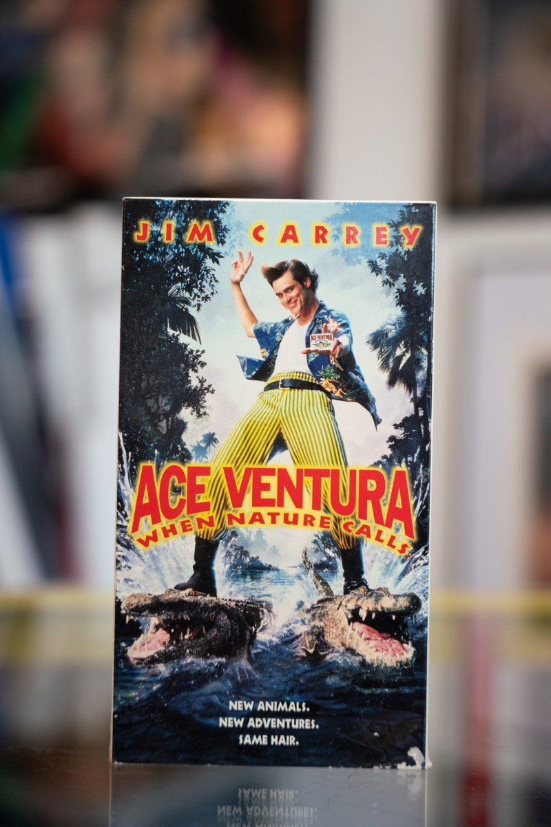 Ace Ventura When Nature Calls VHS tape with Jim Carrey in Hawaiian shirt doing martial arts pose over alligators in jungle