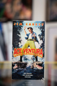 Ace Ventura When Nature Calls VHS tape with Jim Carrey in Hawaiian shirt doing martial arts pose over alligators in jungle