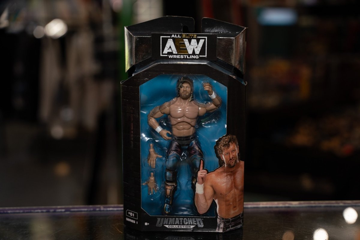AEW Unmatched Collection Kenny Omega action figure with detailed articulation and wrestling attire, displayed against neutral background