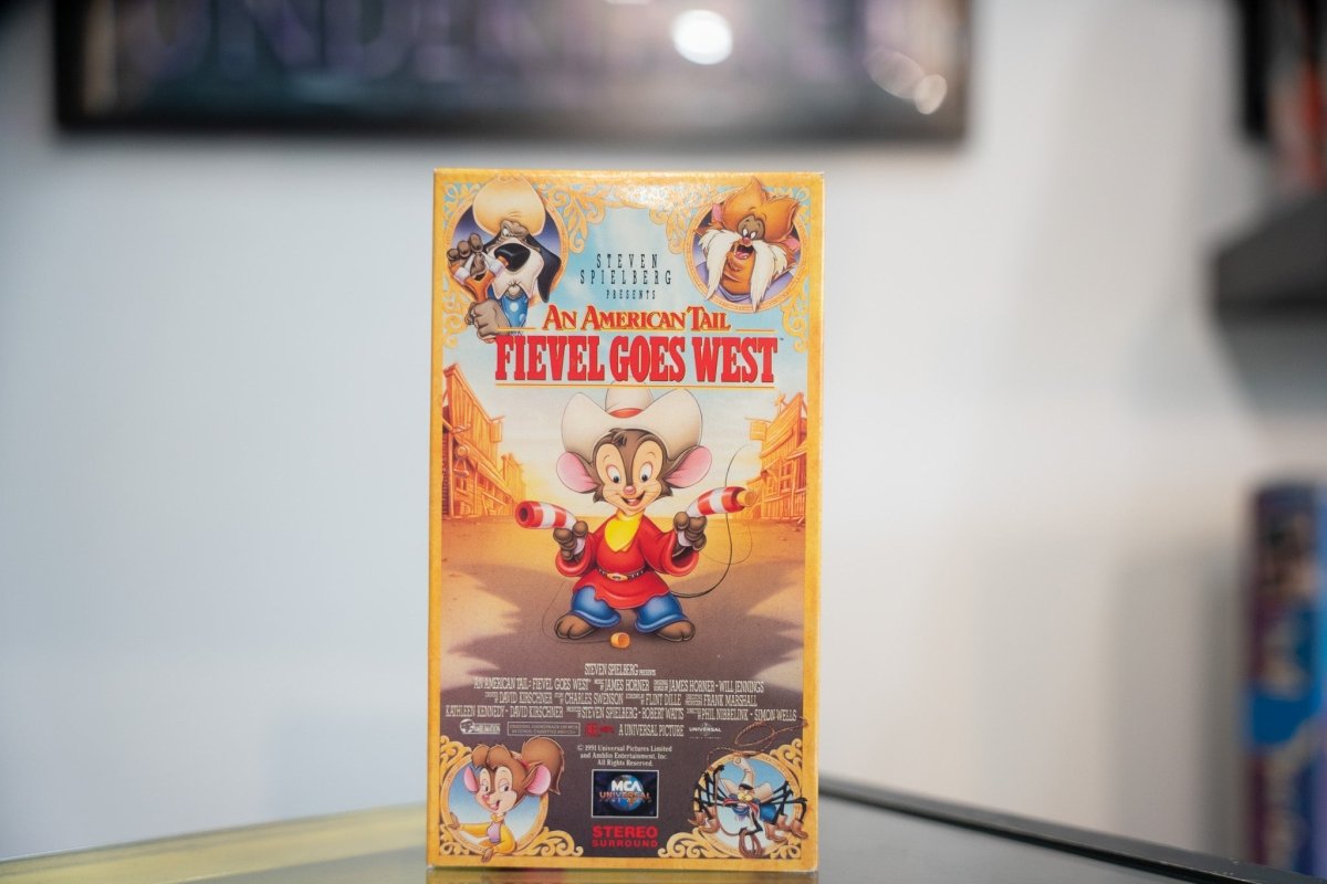 An American Tail Fievel Goes West VHS golden sleeve with Fievel in cowboy hat twirling guns Tanya Tiger Cat R Waul western town Spielberg MCA Universal