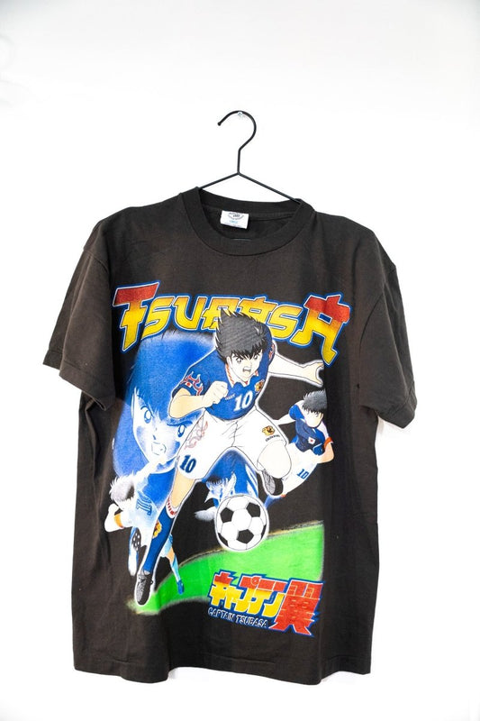 Black Captain Tsubasa t-shirt with bold TSUBASA lettering anime Tsubasa Ozora in white 10 Japan jersey kicking soccer ball Japanese text size Large