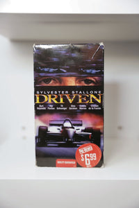 VHS Driven Stallone eyes speed streaks race car track SYLVESTER STALLONE DRIVEN metallic text Burt Reynolds Kip Pardue Pre-Viewed