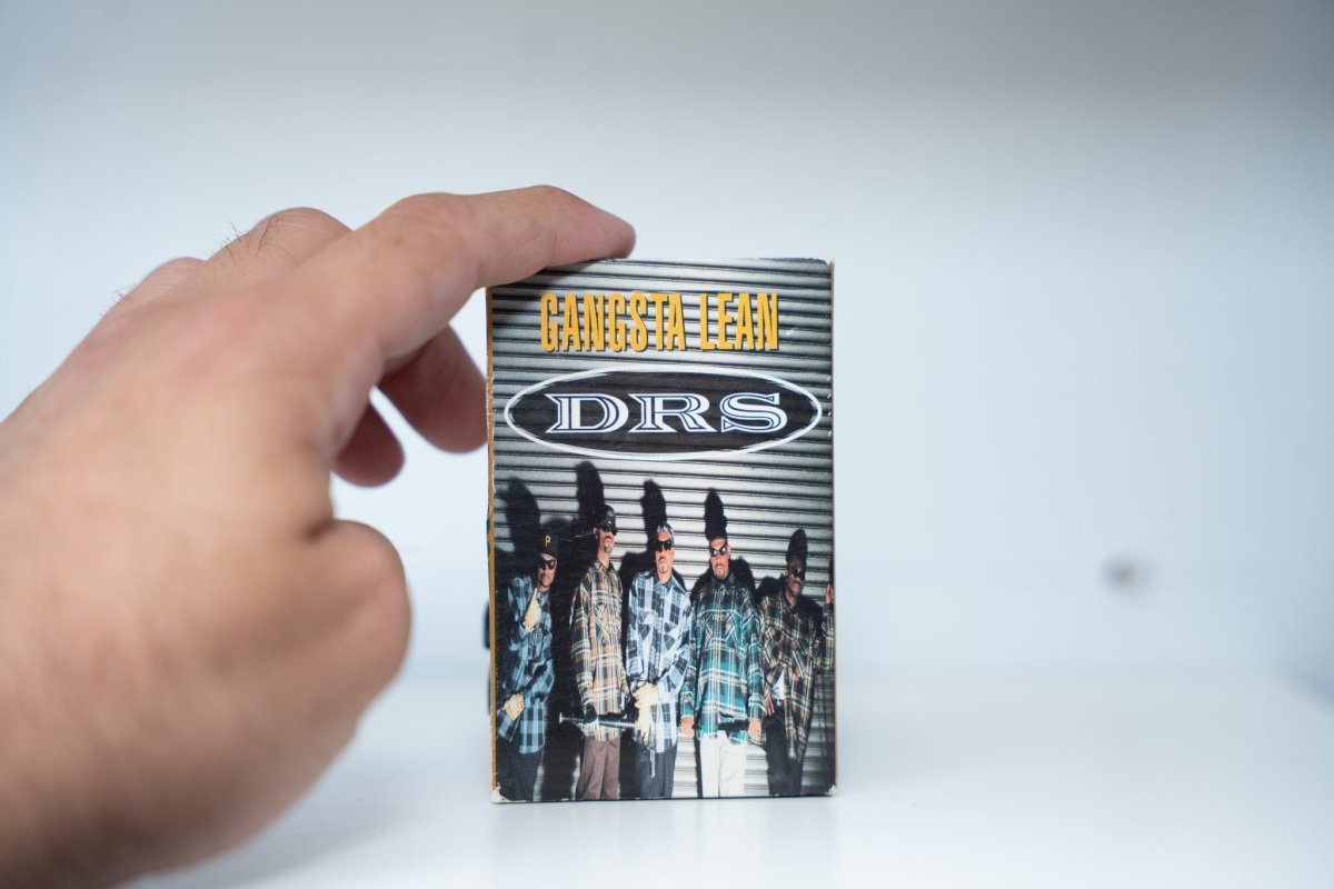 DRS Gangsta Lean cassette single cardboard sleeve group in plaid flannel shirts metal door GANGSTA LEAN yellow text DRS white logo