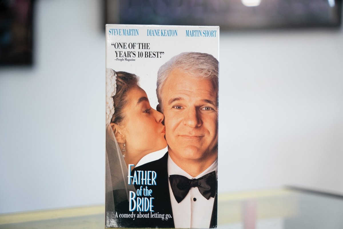 Father of the Bride VHS with Steve Martin in tuxedo daughter kissing cheek in wedding veil elegant title and People Magazine quote