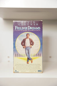 VHS Field of Dreams Kevin Costner golden light leather jacket cornfield purple sky KEVIN COSTNER FIELD OF DREAMS text believe impossible tagline MCA PG