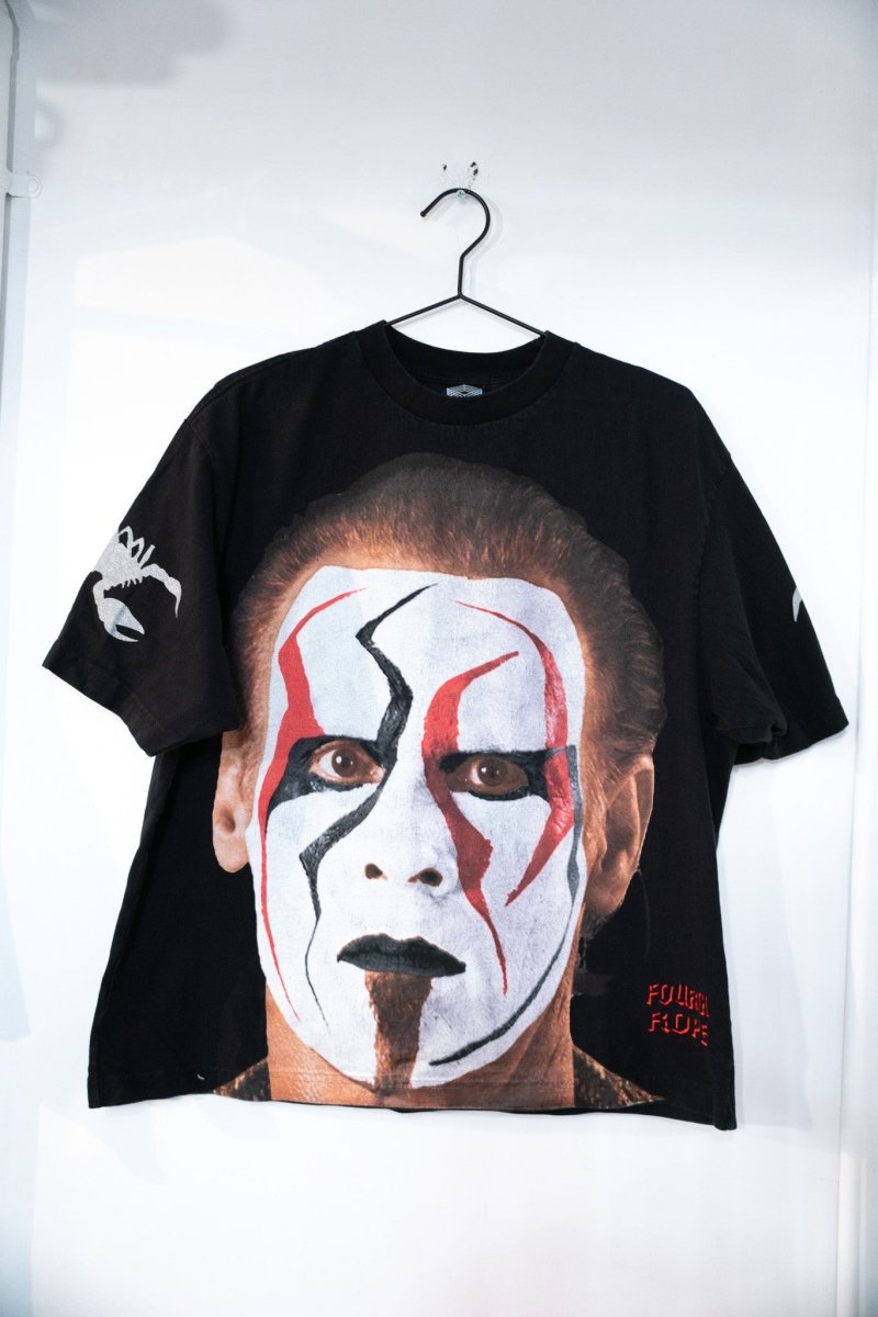 Black Fourth Rope Sting Icon tee with massive full-front photographic face paint portrait in white red and black with scorpion on sleeve