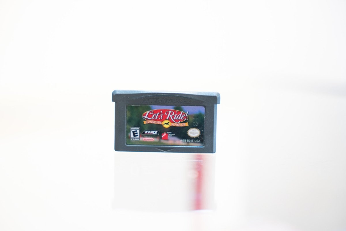 Game Boy Advance Let's Ride Sunshine Stables dark grey cartridge with horse silhouette logo, THQ and Digital Leisure logos, Everyone rating