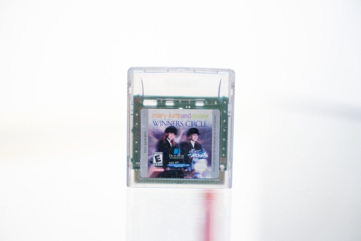 Game Boy Color Mary-Kate and Ashley Winners Circle clear cartridge in case with Olsen twins in equestrian outfits, Acclaim and Dualstar logos