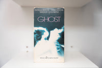 Ghost VHS cover with Patrick Swayze and Demi Moore in ethereal blue-toned embrace, Winner of 2 Academy Awards text