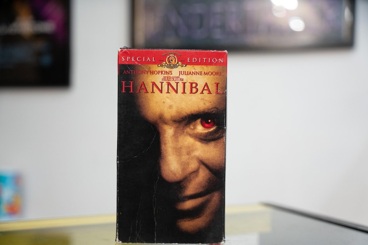 Hannibal VHS Special Edition with Anthony Hopkins half-face close-up red glowing eye amber light gold HANNIBAL title and MGM banner