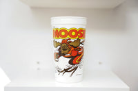 Hardee's The Moose white plastic cup with cartoon moose skiing in red winter gear, yellow and red block letter title