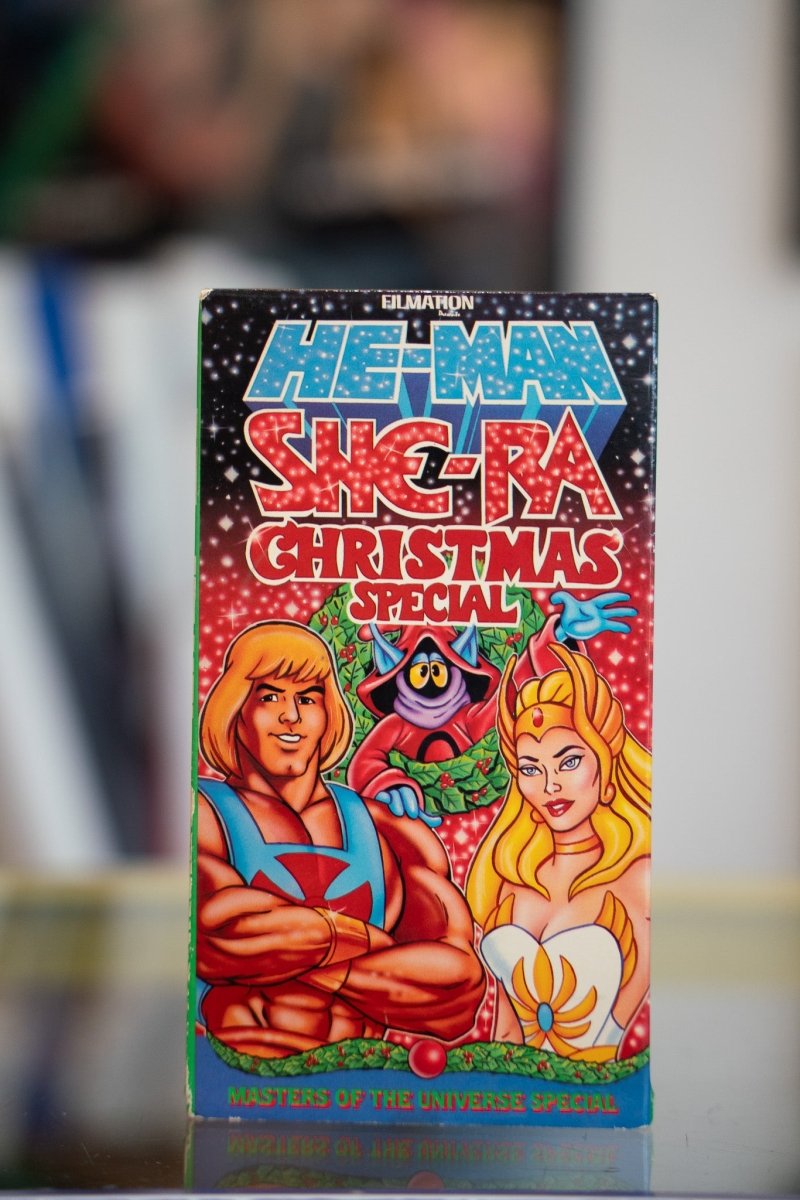 He-Man She-Ra Christmas Special VHS tape with He-Man, She-Ra, and Orko with wreath on starry cover with bold block lettering