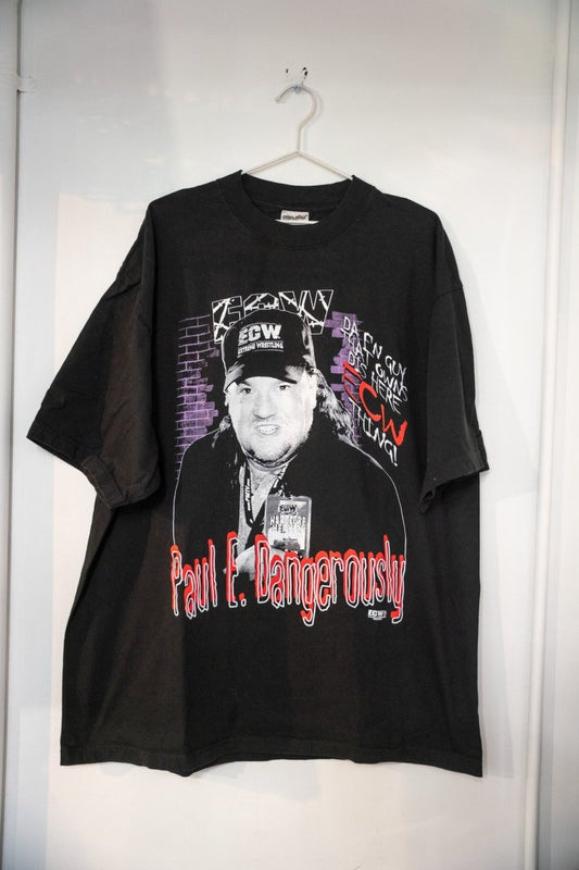 Black ECW Paul E Dangerously t-shirt with black and white Paul Heyman photo in ECW cap purple brick wall background and red script lettering size XXL