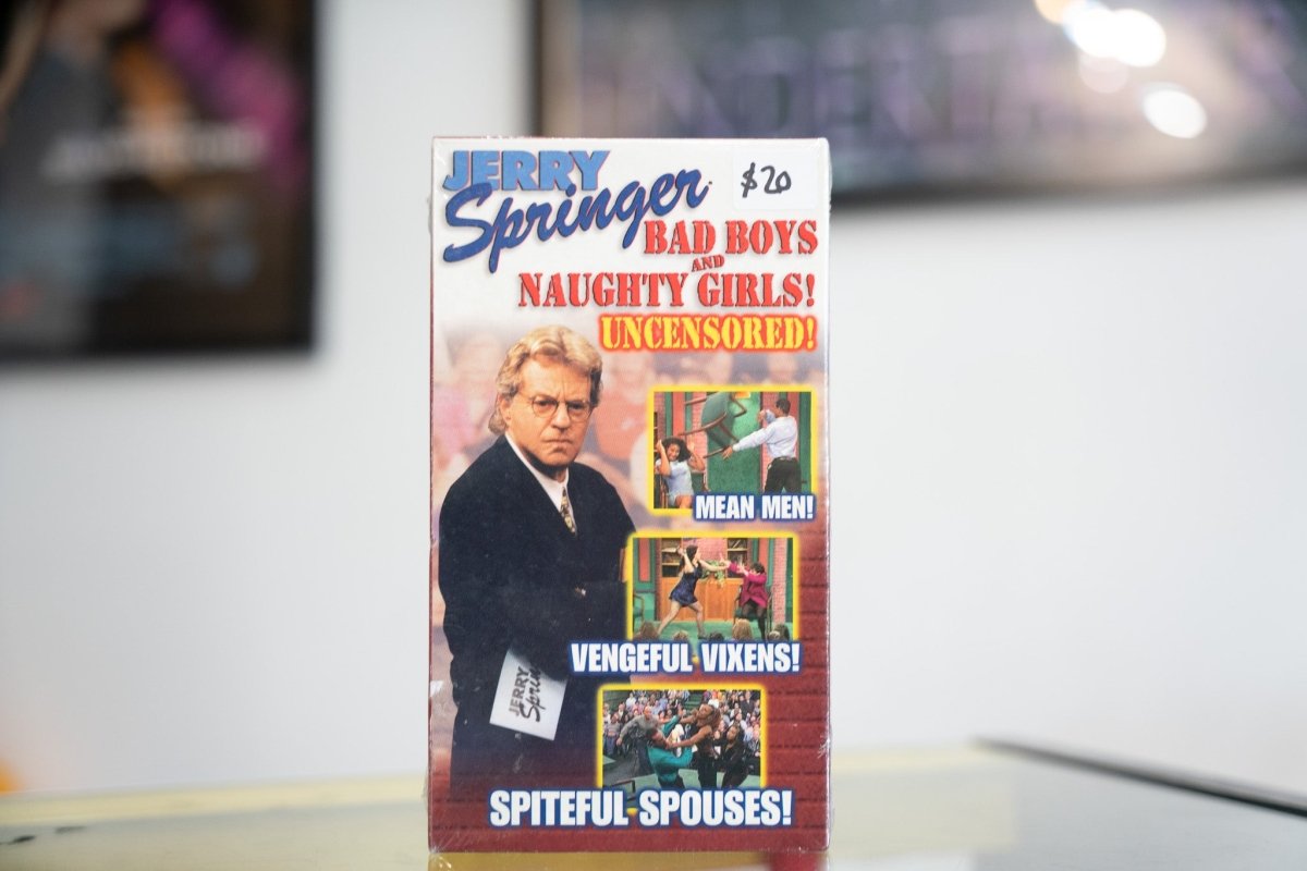 Sealed Jerry Springer Bad Boys and Naughty Girls Uncensored VHS with Springer in dark suit scene photos Mean Men Vengeful Vixens Spiteful Spouses
