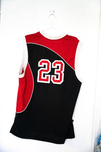 Nike Jordan 20 black and red basketball jersey, size large, displayed flat showing front panels and sleeve details