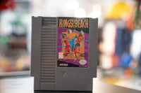 Kings of the Beach Nintendo NES cartridge from 1989, Ultra Games label, black plastic case with colorful volleyball sport game artwork visible on front
