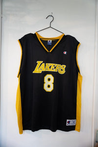 Black Los Angeles Lakers Kobe Bryant number 8 Champion jersey with gold LAKERS script gold side panels and Champion C logo size XL