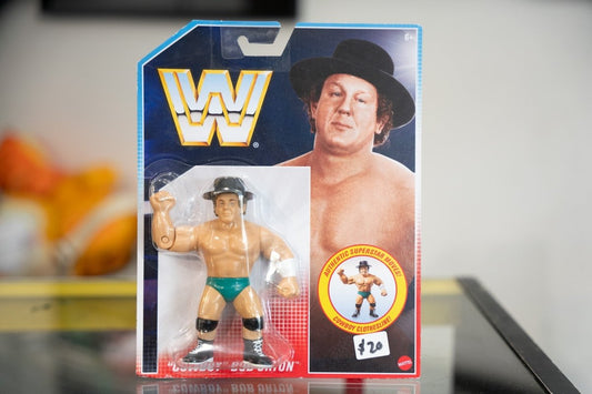 Mattel WWE Retro Cowboy Bob Orton action figure retro packaging black cowboy hat green trunks Cowboy Clothesline move badge WWF logo