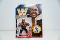 Mattel WWE Retro Zeus action figure retro packaging light blue border shirtless muscular black pants silver wrist cuffs Zeus Zlam move badge