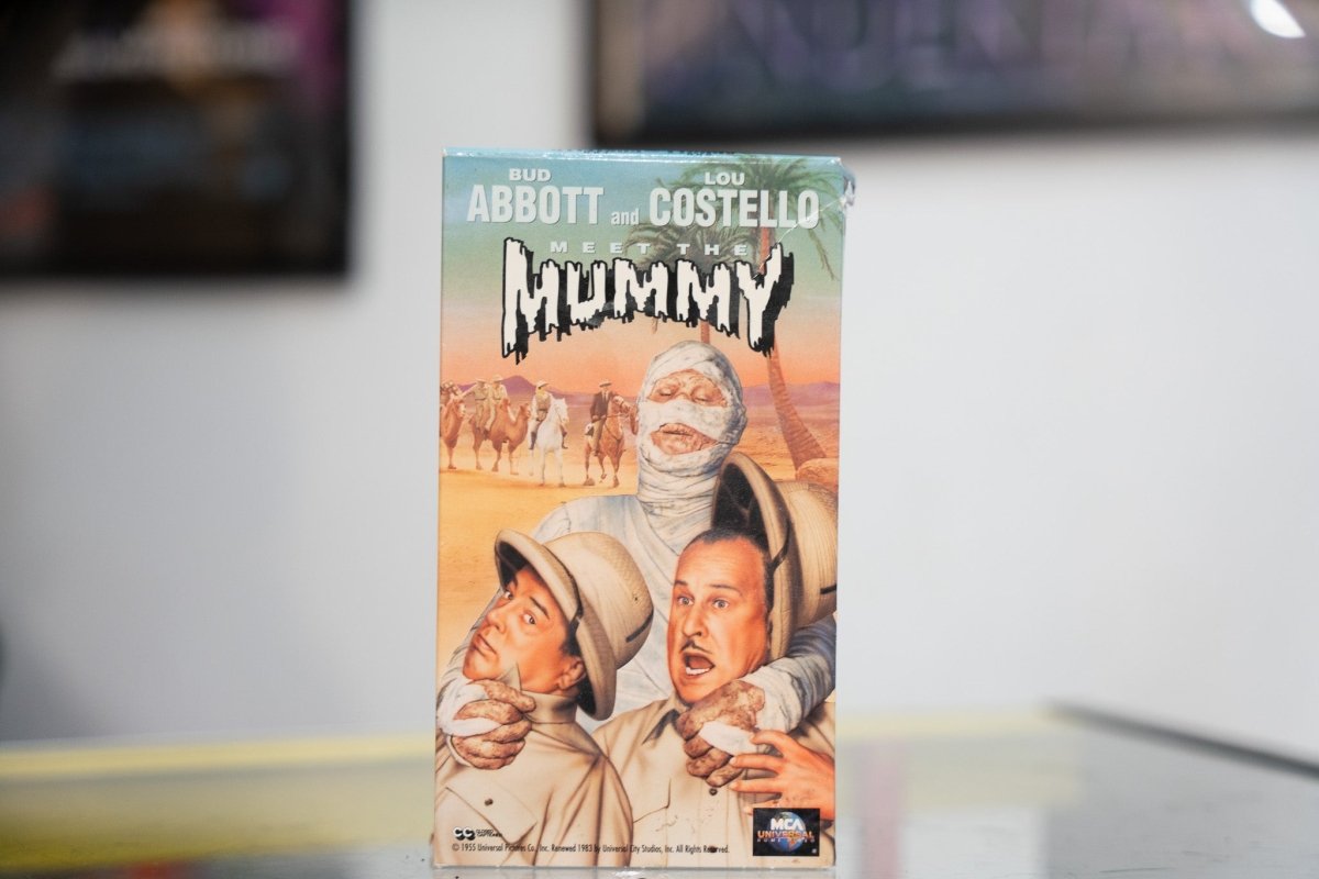 Abbott and Costello Meet the Mummy VHS with illustrated Mummy behind terrified duo in pith helmets Egyptian desert background and MCA Universal logo
