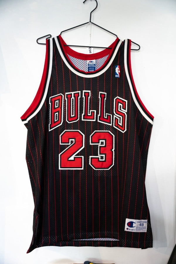 Michael Jordan 96 97 Chicago Bulls black pinstripe Champion stitched jersey number 23 with red lettering and NBA patch size 48