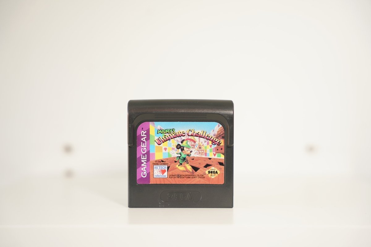 Sega Game Gear Mickey's Ultimate Challenge black cartridge Mickey Mouse green outfit castle checkerboard Ultimate Challenge text Disney Hi Tech Sega