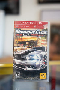 Midnight Club LA Remix PSP Greatest Hits game in red banner case with silver muscle car and Hollywood skyline cover art