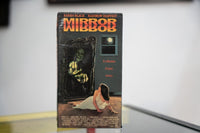 Mirror Mirror VHS dark sleeve with orange red reflected title ghoulish green face reaching through gothic mirror frame woman recoiling Academy Entertainment