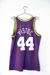 Mitchell & Ness Utah Jazz Hardwood Classics 1974-75 basketball jersey in white with purple and gold trim, size large, displayed flat