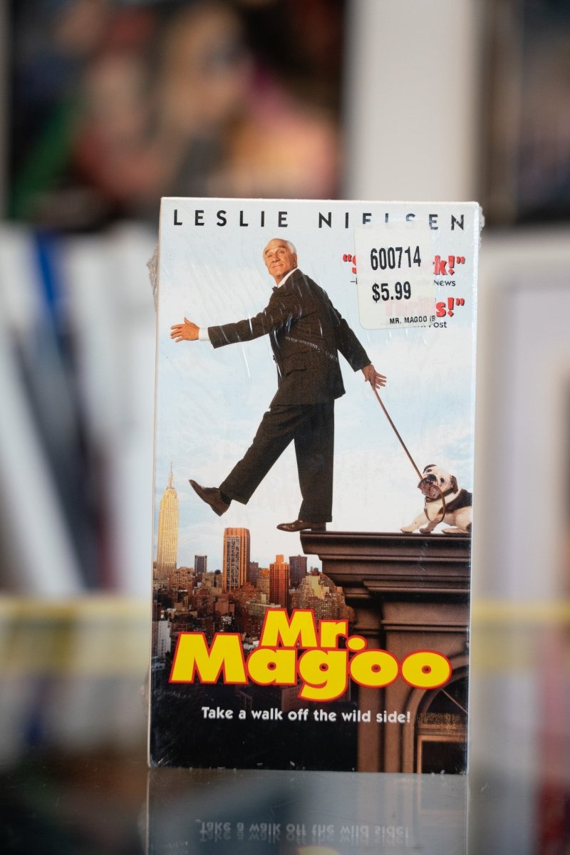 Mr Magoo VHS tape sealed in shrink wrap with Leslie Nielsen stepping off building ledge above New York City skyline