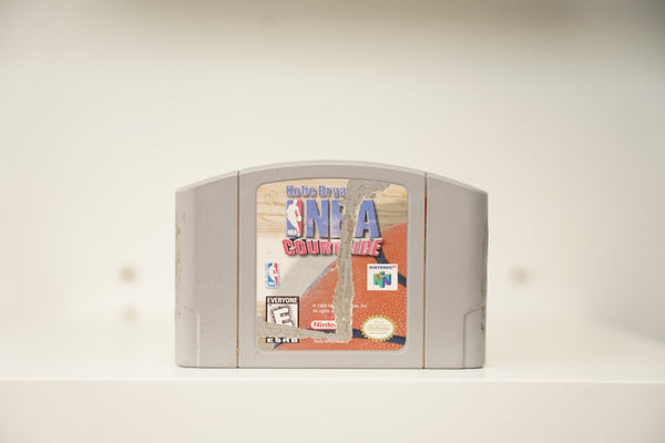 N64 Kobe Bryant's NBA Courtside grey cartridge with basketball texture label showing wear and peeling, NBA logo, Nintendo logo