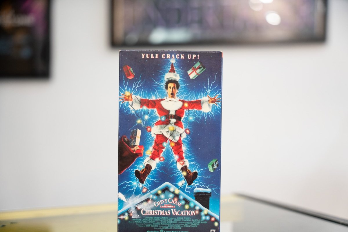 National Lampoons Christmas Vacation VHS dark blue sleeve Chevy Chase Santa suit tangled Christmas lights electrified rooftop Yule Crack Up Warner Bros