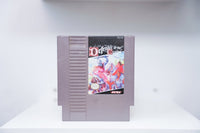 NES Defender of the Crown grey cartridge with medieval knights jousting on horseback, ornate Celtic-style title lettering, Ultra Games logo
