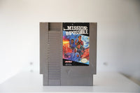 NES Mission Impossible gray cartridge three agents suits explosions helicopters MISSION IMPOSSIBLE white text ULTRA Konami Nintendo