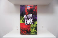 VHS NFL Rocks on the Edge NFL shield logo football action concert crowd purple red green tint NFL ROCKS ON THE EDGE white text