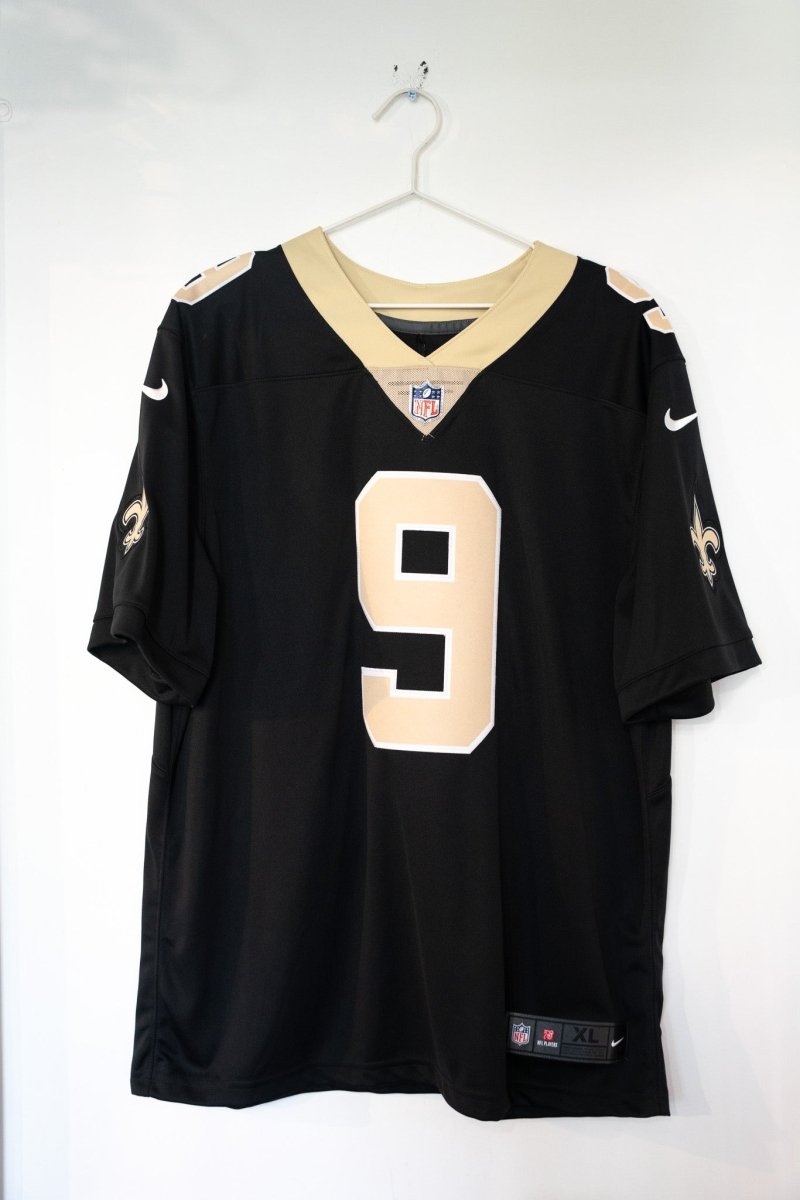 New Orleans Saints Drew Brees number 9 black Nike On Field Dri-Fit jersey with gold collar and fleur-de-lis patches NWT size XL