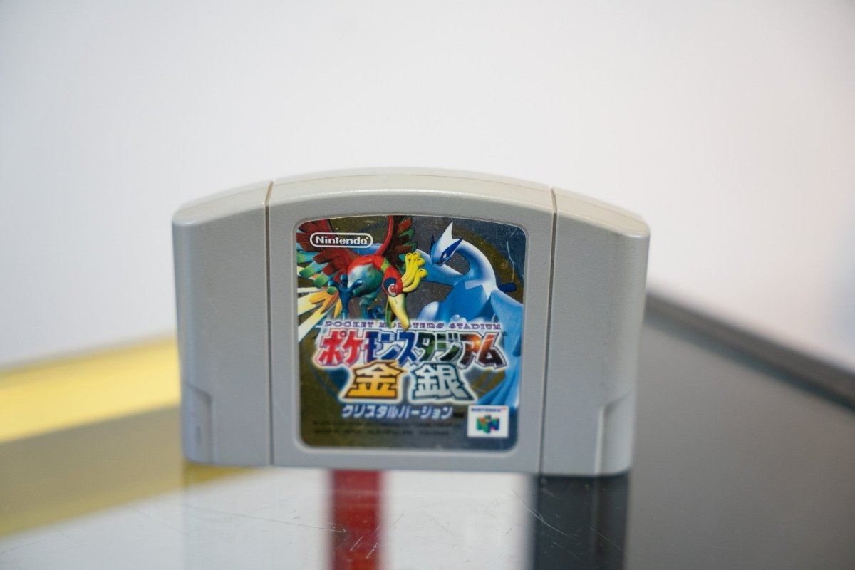 Nintendo 64 Pokémon Stadium Gold Silver Crystal Version Japanese import cartridge gray with Ho-Oh Lugia legendary Pokémon label art