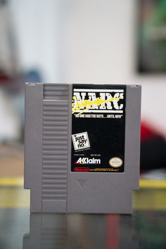 Nintendo NES NARC gray cartridge with black label white NARC lettering yellow splatter and Just Say No International logo by Acclaim