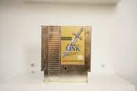 NES Zelda II The Adventure of Link gold cartridge ornate sword ZELDA II green text Adventure of LINK blue text Nintendo Seal