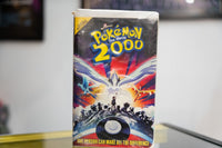 Pokemon the Movie 2000 VHS dark sleeve with Lugia wings spread Articuno Zapdos Moltres Ash silhouette Poke Ball and One Person tagline
