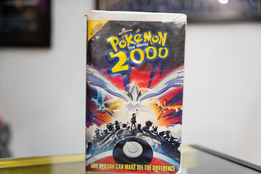 Pokemon the Movie 2000 VHS dark sleeve with Lugia wings spread Articuno Zapdos Moltres Ash silhouette Poke Ball and One Person tagline