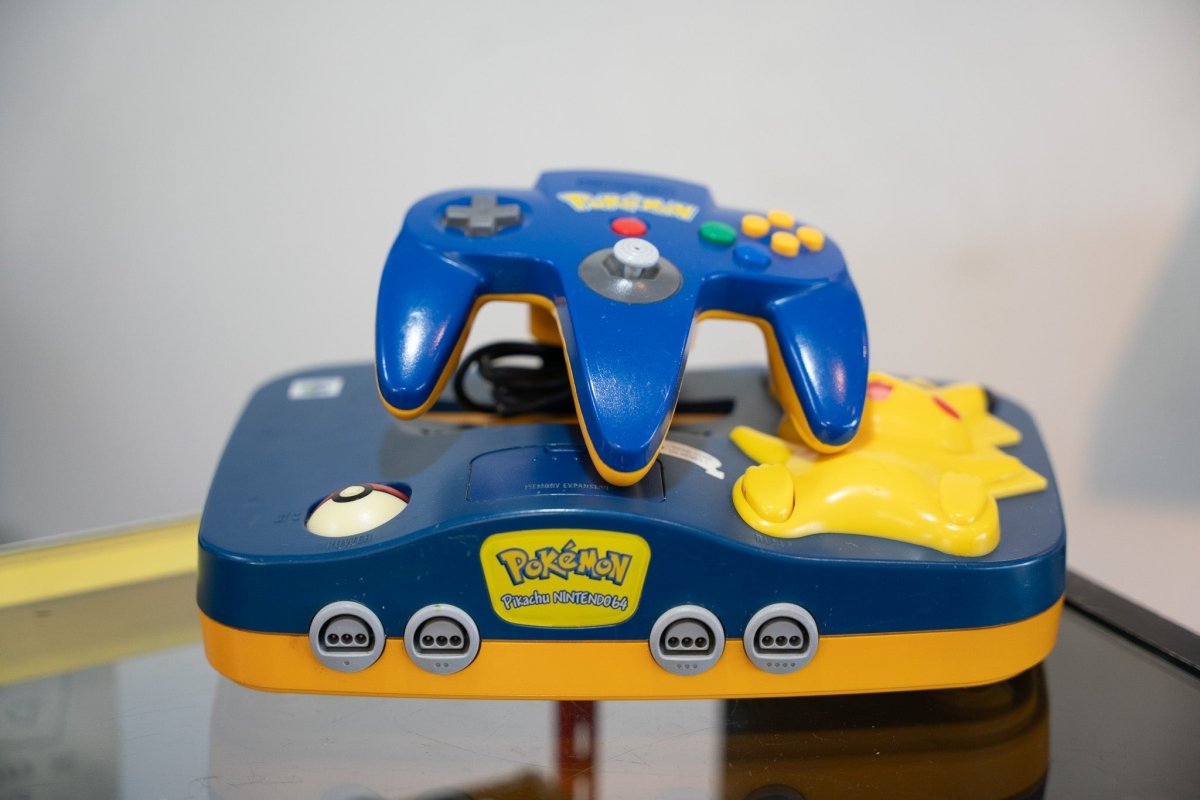 Pokémon Pikachu Nintendo 64 special edition console dark blue yellow with 3D Pikachu figure Poké Ball matching blue yellow controller
