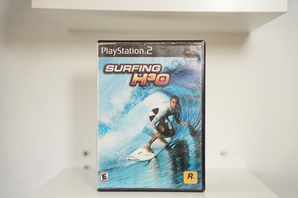 PS2 Surfing H3O case surfer barrel wave blue water wetsuit SURFING H3O red silver text Rockstar Games Everyone
