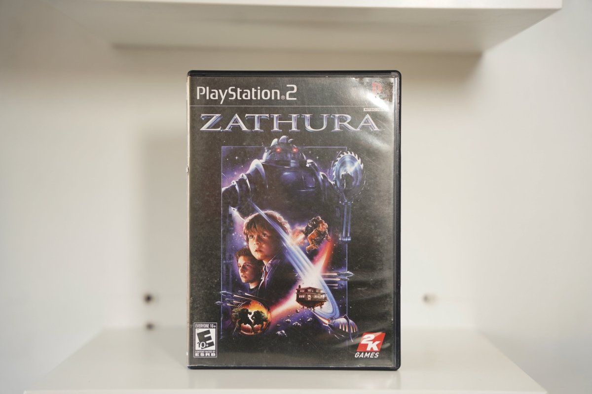 PS2 Zathura case two boys robot red eyes house floating space planets ZATHURA silver text 2K Games Everyone 10+
