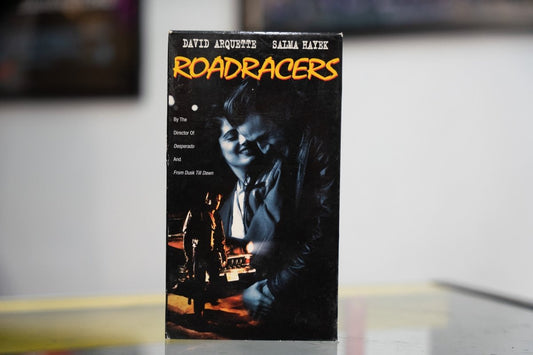 Black Roadracers VHS with blue-tinted David Arquette and Salma Hayek intimate photo yellow ROADRACERS title and Director of Desperado credit