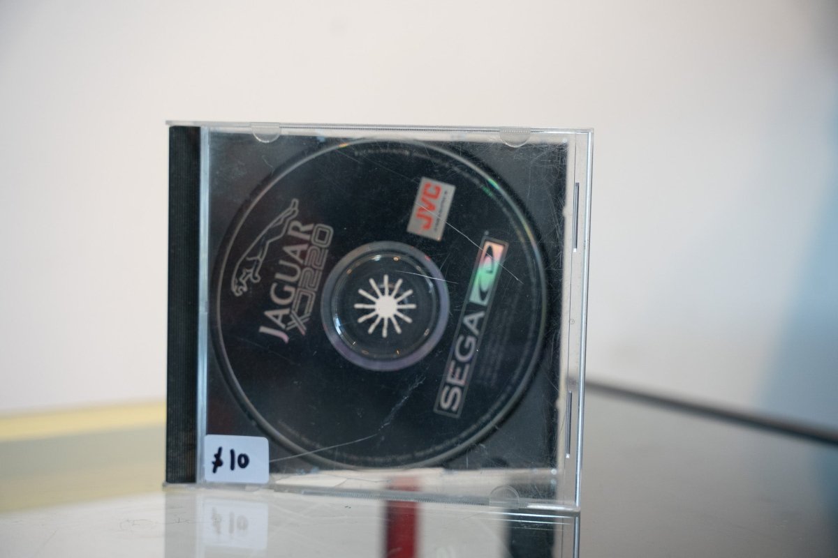 Sega CD Jaguar XJ220 disc only black disc in jewel case white gold JAGUAR XJ220 text Jaguar leaping cat logo JVC Sega