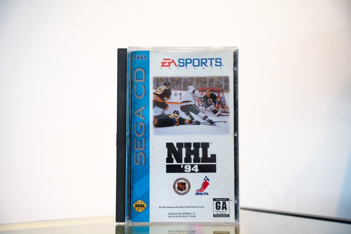 Sega CD NHL 94 game complete in tall case blue spine hockey action cover EA Sports NHL NHLPA logos GA rating