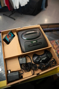 Sega Genesis console with original box, controllers, and Sonic the Hedgehog 2 game cartridge, 1992 release